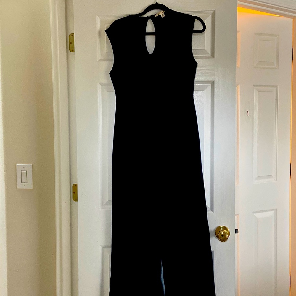 Jumpsuit color Navy blue. Back is key hole